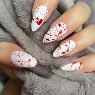Photo Credit: http://www.storenvy.com/products/9877057-h1-doobys-nails-blood-splatter-stiletto-24-hand-painted-false-nails