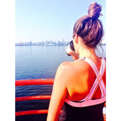 Girl looking at a lake after a run